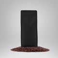 Black gusset packaging mockup with degassing valve, presentation of stable pouch on coffee beans, isolated on background Royalty Free Stock Photo
