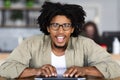 Black Guy In Eyeglasses Typing On Laptop And Looking At Screen, Pov Royalty Free Stock Photo