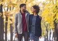 Black guy and girl having romantic date at autumn park Royalty Free Stock Photo