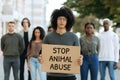 Black guy holding placard stop animal abuse Royalty Free Stock Photo