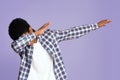 Black guy making dab gesture on pink studio background Royalty Free Stock Photo