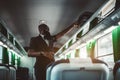 Black guy picking suitcase in train