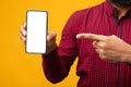 Black guy showing blank cell phone screen Royalty Free Stock Photo