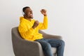 Black Guy Wearing Headphones Listening To Favorite Song, Gray Background Royalty Free Stock Photo