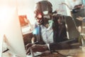 A black guy works as a call center operator. Royalty Free Stock Photo