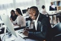 A black guy works in a call center. Royalty Free Stock Photo