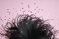 Black Hair on a pink background. Beautiful and strong hair, hair texture, root care brunette