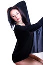 Black haired beautiful dancer covered by a see through material Royalty Free Stock Photo