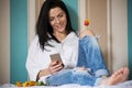 Black haired young woman in her bed in the morning Royalty Free Stock Photo