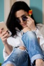 Black haired young woman in her bed in the morning Royalty Free Stock Photo