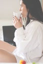 Black haired young woman in her bed in the morning Royalty Free Stock Photo