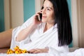 Black haired young woman in her bed in the morning Royalty Free Stock Photo