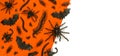 Black Halloween creepy crawly bugs and spiders on orange background with blank white space for text