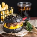 Black hamburger with beef and cheese