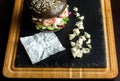 Black hamburger made from beef, with dor-blu. Place for recording.