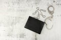 Black handbag, silhouette of man and handcuffs, concept of detective investigation of murder or theft crime Royalty Free Stock Photo