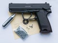 Black sports handgun with target, bullets and compressed air Royalty Free Stock Photo