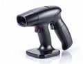 Black Handheld Scanner with Red Trigger on White Surface for Scanning Royalty Free Stock Photo