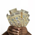 Black hands holding polish zÃâoty notes. closeup of Hands holding polish currency notes