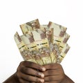 Black hands holding 1000 Kenyan shilling notes. closeup of Hands holding Kenyan currency notes