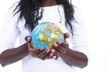 Black hands holding a world globe isolated Royalty Free Stock Photo