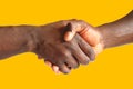 Black handshake - gold background Royalty Free Stock Photo