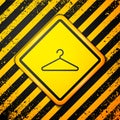 Black Hanger wardrobe icon isolated on yellow background. Cloakroom icon. Clothes service symbol. Laundry hanger sign Royalty Free Stock Photo