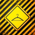 Black Hanger wardrobe icon isolated on yellow background. Cloakroom icon. Clothes service symbol. Laundry hanger sign Royalty Free Stock Photo