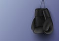 Black hanging boxing gloves banner with copy space realistic vector fight sport equipment