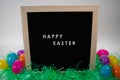 A Sign That Says Happy Easter With Easter Eggs