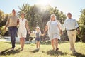 Black happy family, holding hands and walk in nature park bonding together on summer vacation outdoors. Grandparents Royalty Free Stock Photo