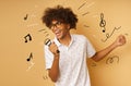 Afro happy man with microphone sing a song Royalty Free Stock Photo