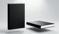 Black hardcover book standing upright and lying flat on a light gray background with soft shadows Royalty Free Stock Photo