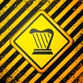 Black Harp icon isolated on yellow background. Classical music instrument, orhestra string acoustic element. Warning