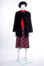 Black hat, coat and striped skirt. Royalty Free Stock Photo