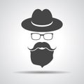 Black hat with mustache, beard and glasses isolated on a grey ba