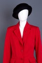 Black hat and red female jacket on mannequin. Royalty Free Stock Photo