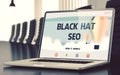 Black Hat SEO on Laptop in Conference Room. 3D. Royalty Free Stock Photo