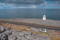 Black Head Lighthouse, county Clare, Ireland - 04.10.2021: Small car parked off the road. Wild Atlantic way, Beautiful nature Royalty Free Stock Photo