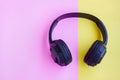 Black Headphone on pink and yellow background Royalty Free Stock Photo