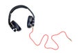 Black headphone and red cable isolate on white background Royalty Free Stock Photo