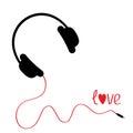 Black headphones with red cord. Love card.