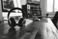 Black headphones on wooden desk Royalty Free Stock Photo