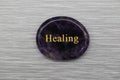 Black Healing mood stone on gray background Royalty Free Stock Photo