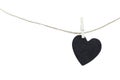 Black Heart hung on hemp rope isolated on white background. Royalty Free Stock Photo