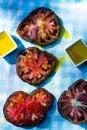 Black heirloom tomatoes sliced drizzled in olive oil Royalty Free Stock Photo