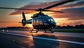 a black helicopter taking off on a runway during the evening Royalty Free Stock Photo