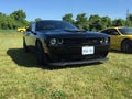 Black hemi powered Challenger at a cars and coffee event in Komoka Ontario