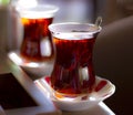 Black herbal turkish tea in traditional glass