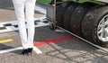 Black high heels and racing tire